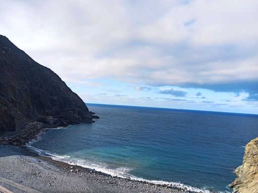 Magical seascape with volcanic hills and blue wavy water in San Sebastian de la Gomera, Canary Islands, Spain.