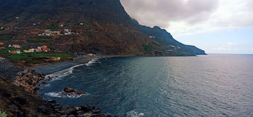 A magical seascape view of town of Hermigua under cloudy sky by the sea, La Gomera, Canary Islands