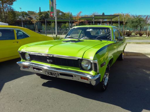 Old green sporty Chevrolet Chevy Nova 230 SS Serie 2 coupe 1972 - 1977 by GM Argentina in a park. Expo Fierro 2022 Classic car show