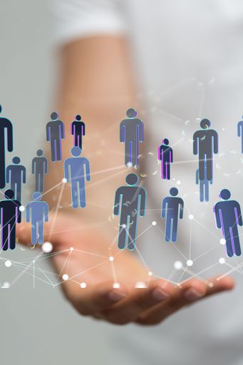 A businessman showing a 3D rendered network with user icons in cyberspace - a vertical shot