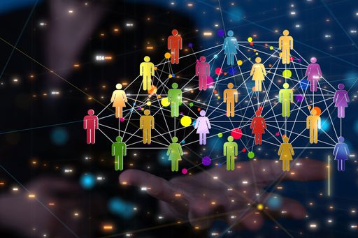 A 3d rendering of people icons connected with lines with a hand pointing at it from the background