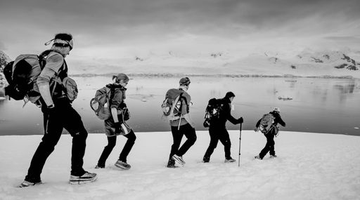 A grayscale shot of the team Born to Run at racing the planet's 'Last Desert in Antarctica' event