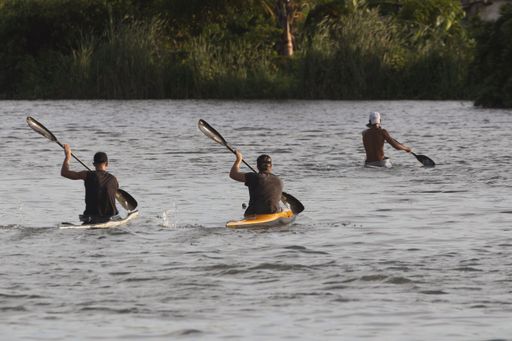 a view of sportsmen paddling canoe on the San Juan river in Mata, Cuba