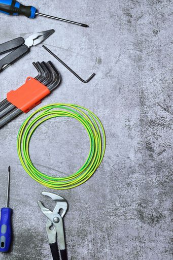 An assortment of tools and variety isolated on a stone background