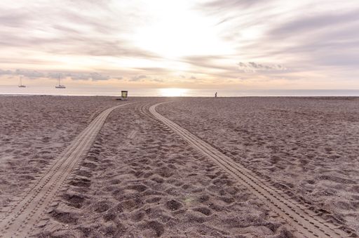 Wheel Tracks in the Sand of a Sandy Beach Desert
