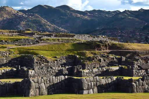 View of the walls of the old citadel Sacsayhuman located above the city of Cusco in Peru