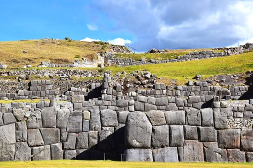 View of the walls of the old citadel Sacsayhuman located above the city of Cusco in Peru