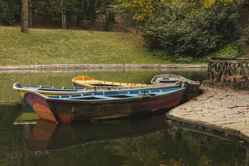 Wooden boats at a shore of a lake
