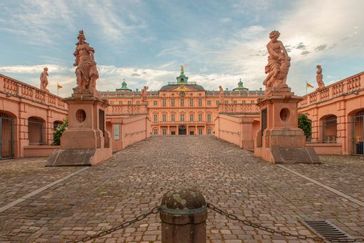 A cobblestone street leading to Schloss Rastatt museum in Rastatt, Germany
