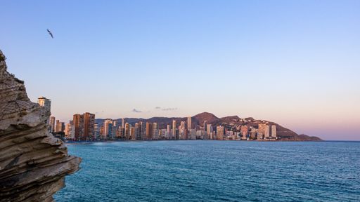 A mesmerizing view of the beautiful cityscape and seascape at sunset
