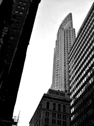 The skyscrapers of downtown Toronto in a low-angle grascale shot