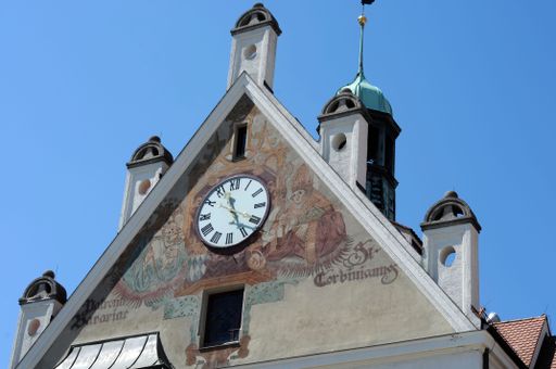 Historic views on a summer day in Freising, bavaria, showing the exterior facade with clock and turrets on the r