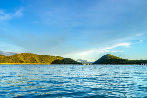Beautiful landscape scenic by the sunlight shade in the sky and water in the dam (Srinakarin dam, Kanchanaburi, Thailand)