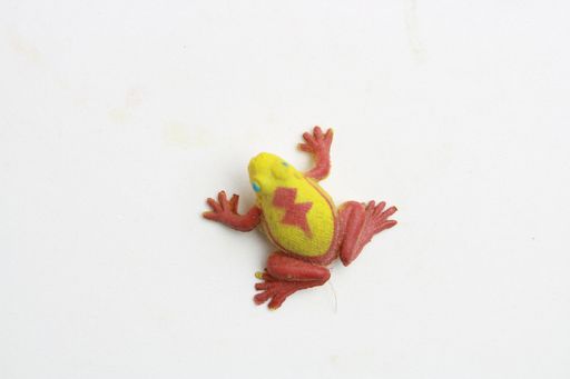 A closeup shot of rubber toy with frog shape isolated on a white background