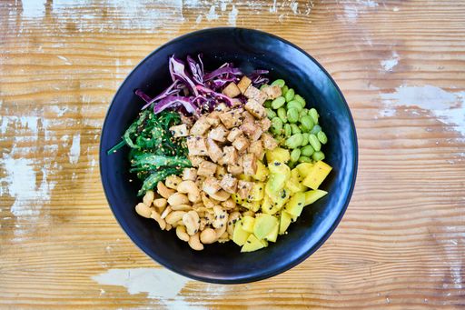 A top view of the poke with chicken, salmon and avocado