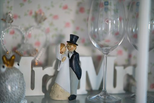 A closeup shot of a bride and groom miniatures for wedding cake decoration