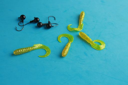 A top view of fishing lures isolated on a blue background