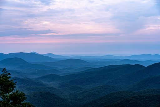 A beautiful shot of a bright sunset sky over Preacher Rock in Georgia, USA