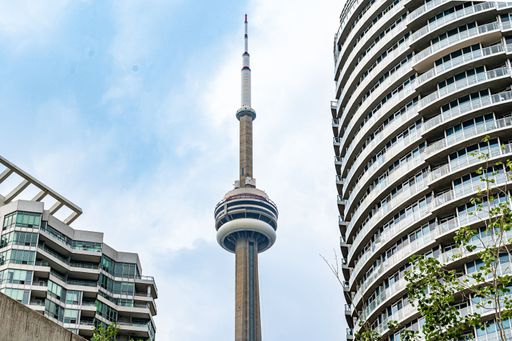 The CN Tower against blue cloudy sky background in Toronto, Ontario, Canada
