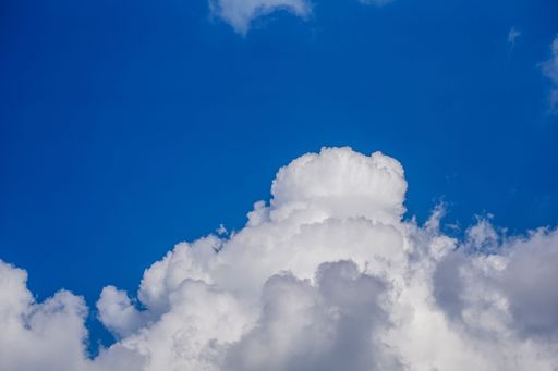 White fluffy clouds in the blue sky