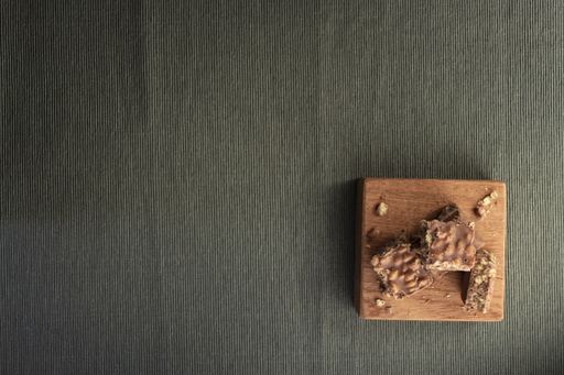 A high angle shot of the delicious homemade chocolate cookies on a grey surface