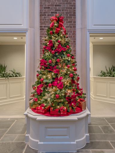 A vertical shot of a Christmas tree decorated with beautiful Christmas ornaments