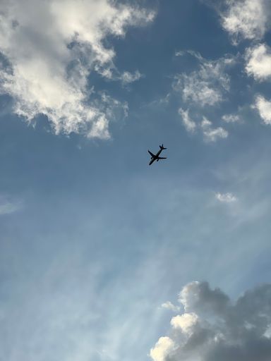 A low angle shot of an airplane in the sky