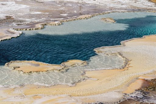 A high angle shot of flowing geysers in Yellowstone National Park