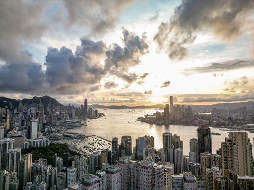 A high angle shot of a beautiful scenery of Victoria peak in Hong Kong under cloudy sunset sky