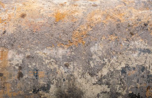 The texture is a rusty and dirty surface of an old steel pipe that has just been pulled out of the ground.
