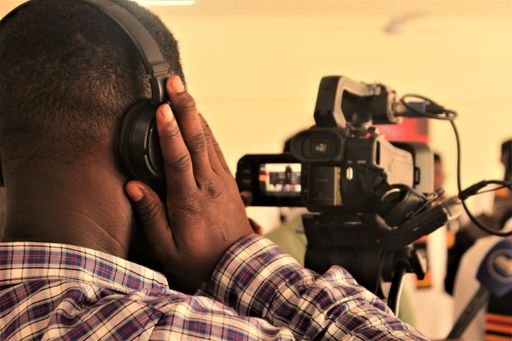 A closeup shot of a guy during an on going coverage in Ghana for MTA