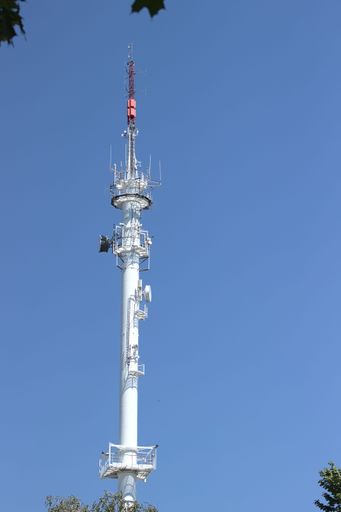 A vertical shot of the Radio broadcasting mast against the blue sky