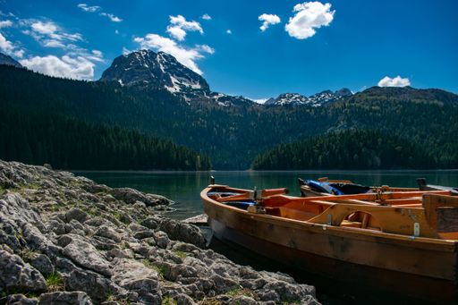 The boats moored near the shore of Black Lake in Durmitor National Park. Montenegro.