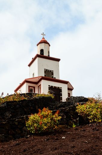 A vertical shot of a chapel Belfry of Ermita de la Caridad