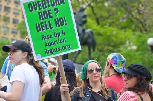 A closeup of people protesting against overturning Roe v. Wade in New York