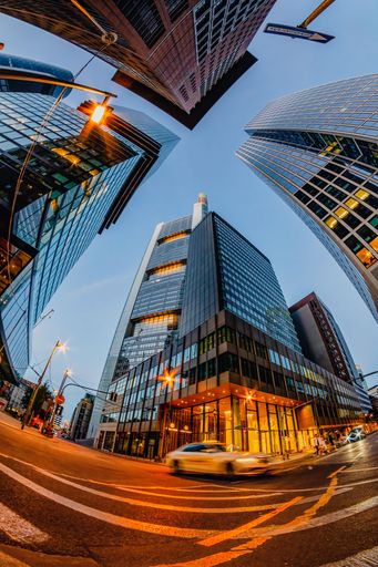 A vertical fish-eye shot of the skyscrapers in the Frankfurt am Main city at night