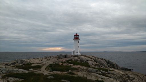 The Peggy's Cove lighthouse in Canada on a cloudy day