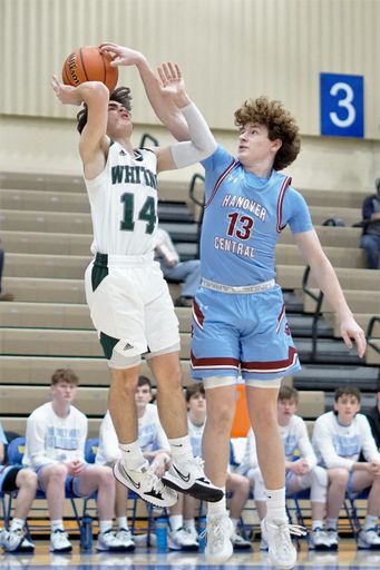 A vertical of the Hanover Central and Whiting competing during a high school basketball competition