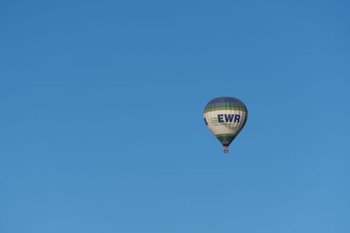 ronda,malaga,spain, june 28th, 2022 hot air balloon in isolated flight in the blue sky