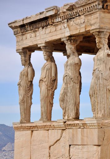 A vertical shot of the The Porch of the Caryatids in Acropolis, Athens, Greece
