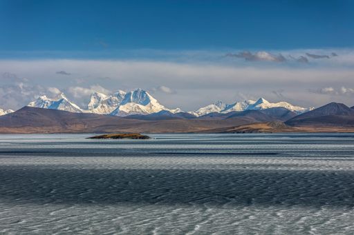 A beautiful landscape of a frozen lake in a mountainous area