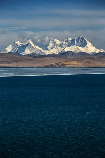 A beautiful landscape of a frozen lake in a mountainous area