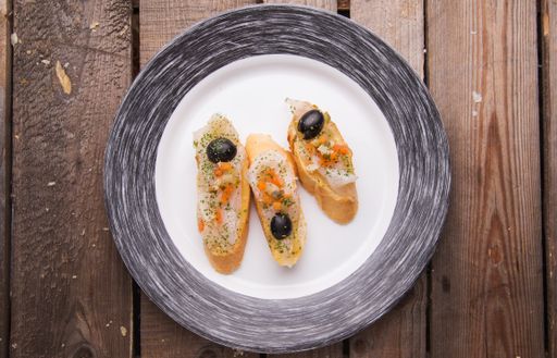 A top view of bruschettas in the plate on the table