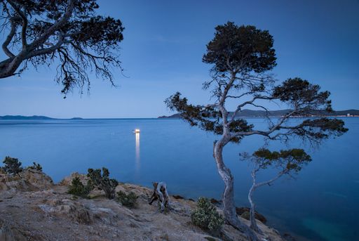 A beautiful scenery with an early morning fishing boat off the coast of Provence near Le Lavandou