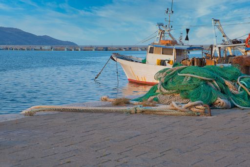 Fishing boat and fishing nets in the port of Manfredonia in the Italian region of Puglia