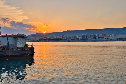 A scenic shot of boats and a waterscape during sunset in Manfredonia Italy