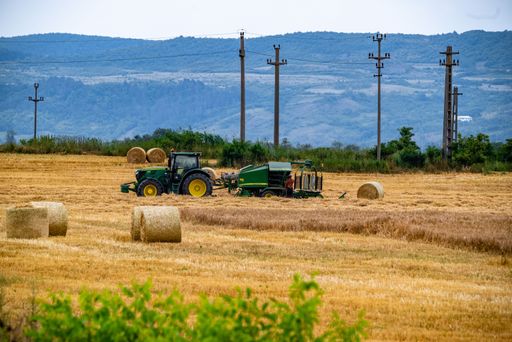 The agricultural machinery working in a field