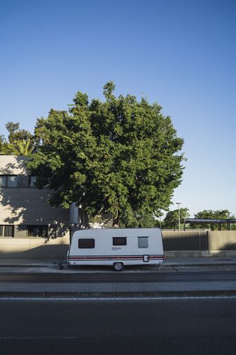 A vertical shot of a classic caravan parked on a street in Jerez de la Frontera, Southern Spain