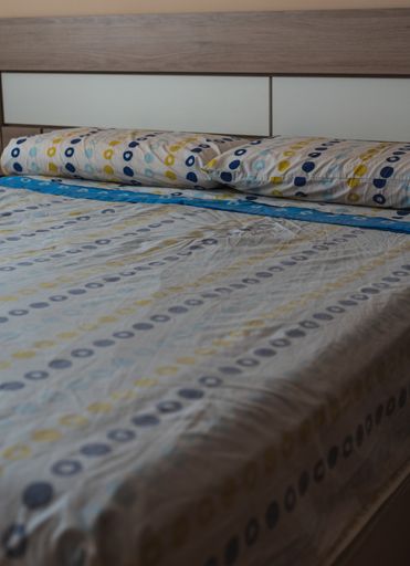 A vertical shot of decorative bed linen