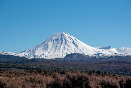 Mt Ngauruhoe and the central plateau in winter. One of the volcanoes in the national park coated with winter snow on a clear blue sky day